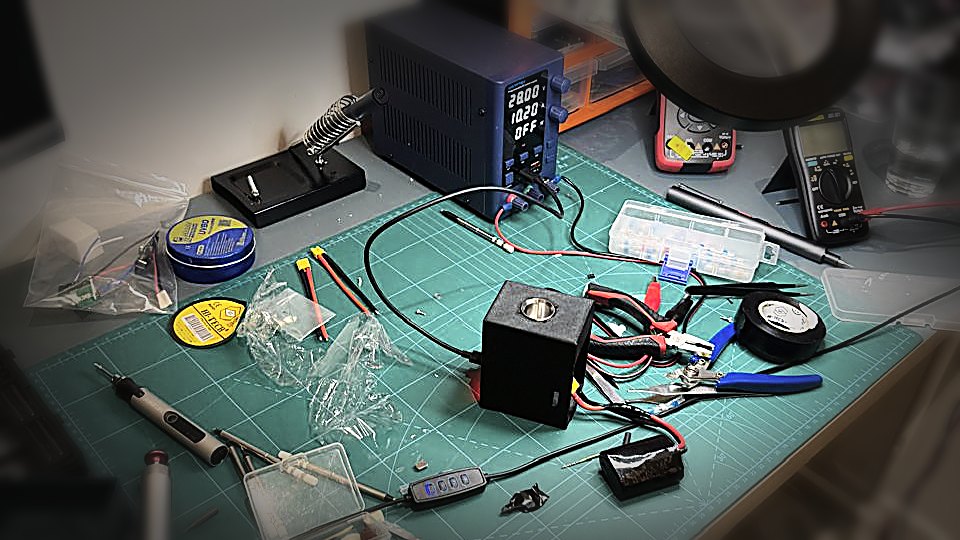 The XOUD workbench in Riyadh — power supply, meters and the prototype